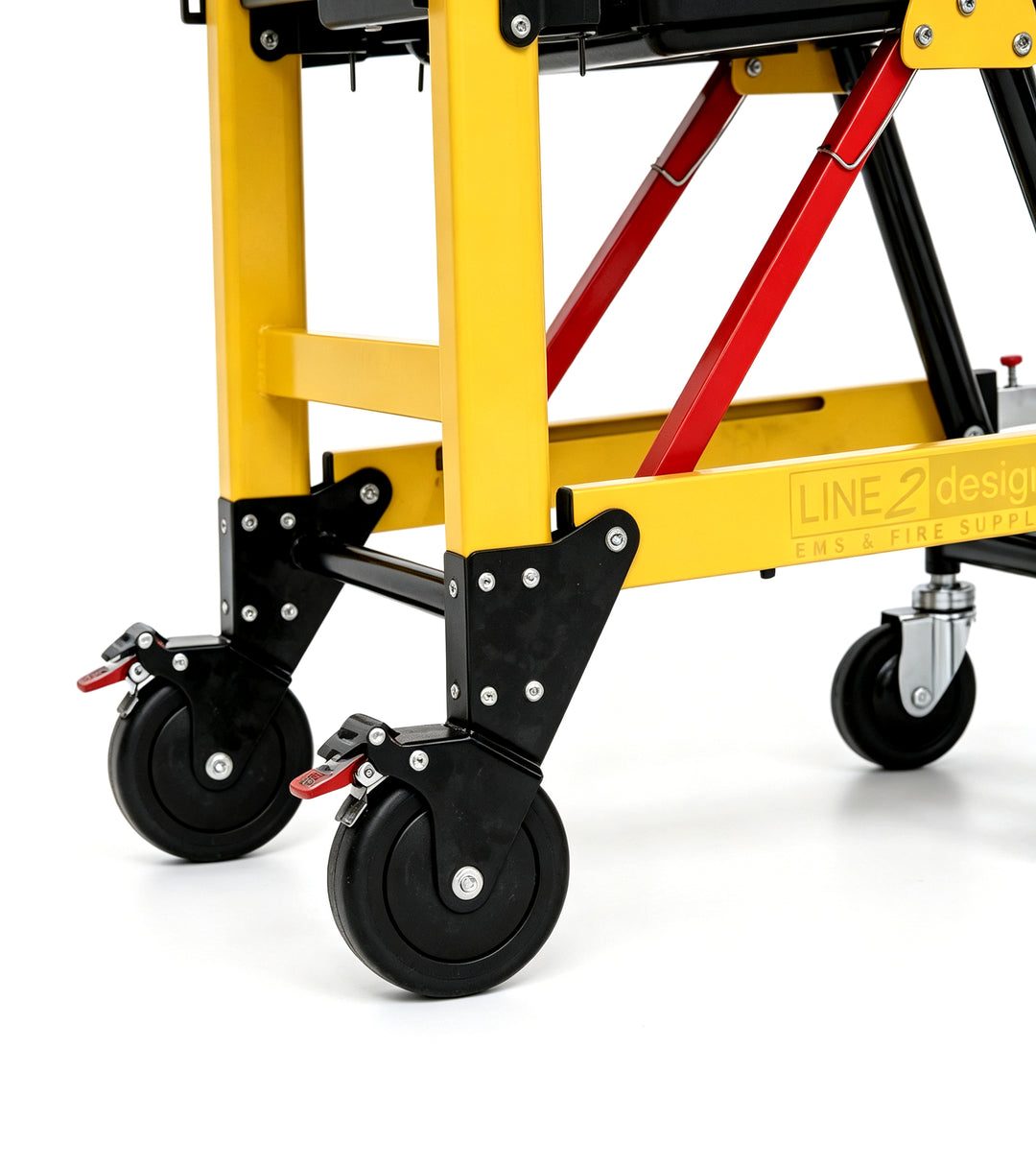Close-up of a yellow and black wheeled cart frame with red support beams and black caster wheels, showing the brand name LINE 2 design on the yellow frame.